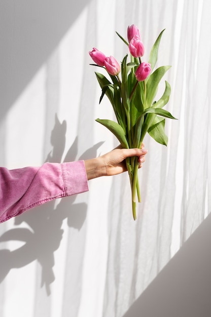 Hand holding elegant flower