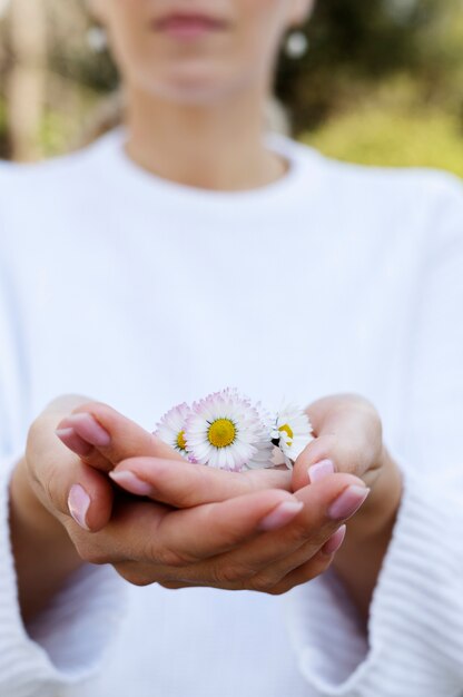 Hand holding elegant flower