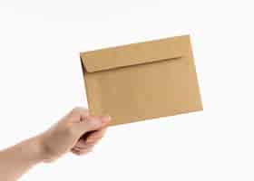 Free photo hand holding envelope