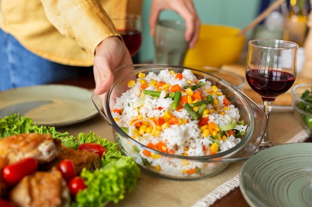 Hand holding food bowl close up