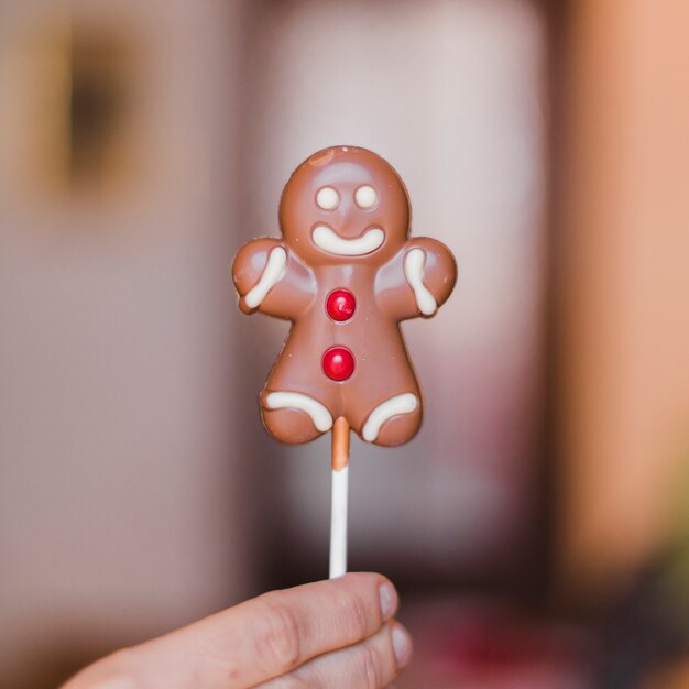 Hand holding gingerbread man