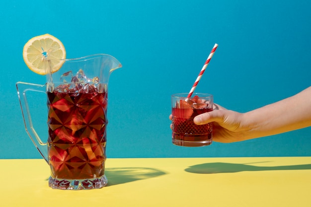 Hand holding glass with sangria