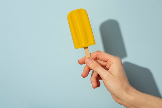 Hand holding ice cream pop stickle