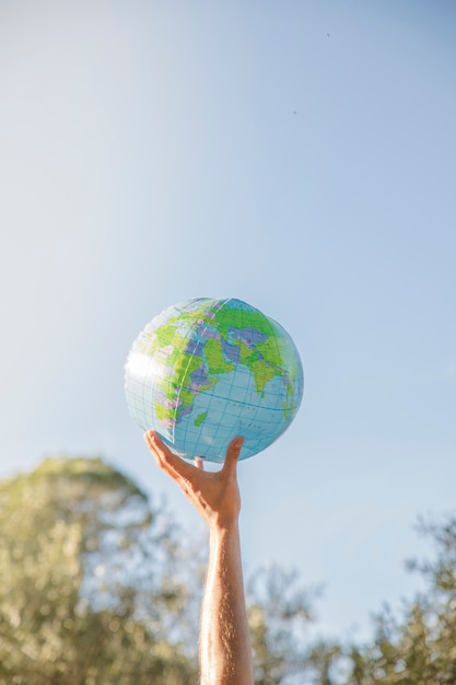 Hand holding inflatable planet model