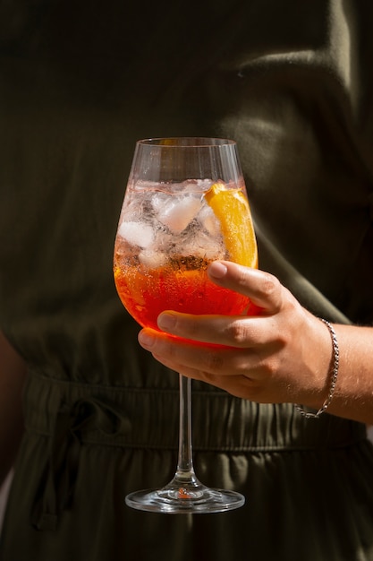 Hand holding italian cocktail still life