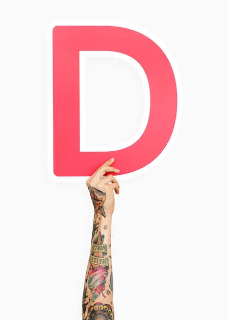 Free photo hand holding the letter d