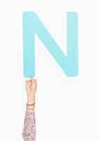 Free photo hand holding the letter n