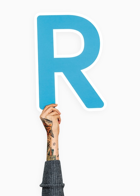 Free photo hand holding letter r sign