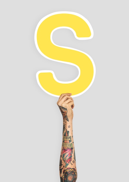 Hand holding letter S sign