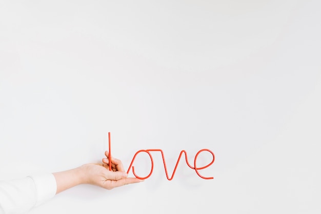 Free photo hand holding love letters