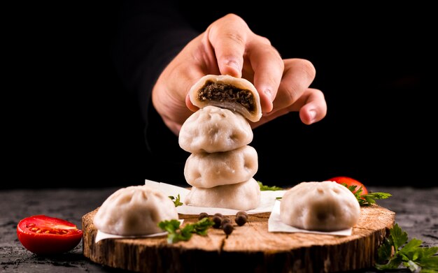 hand holding meat dumpling