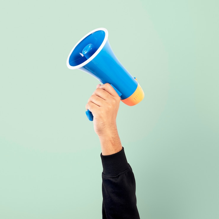 Free Photo hand holding megaphone marketing announcement campaign