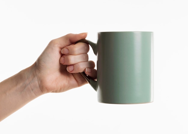 Hand holding mug