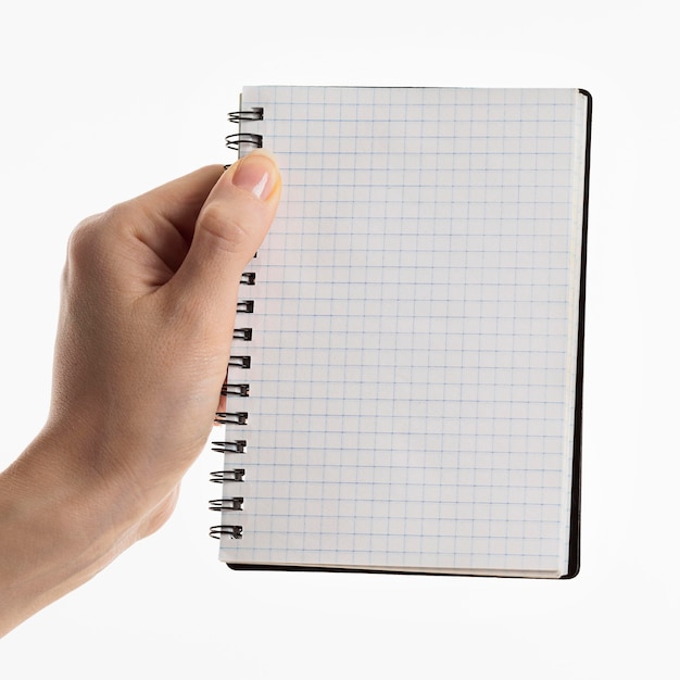 Hand holding notebook