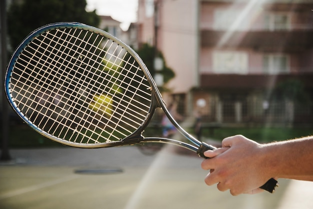 Hand holding racket