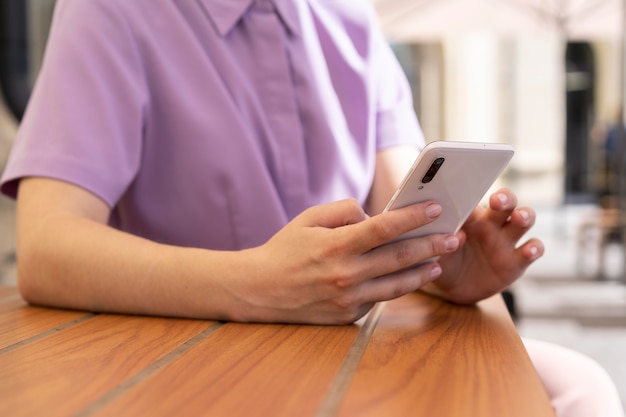 Hand holding smartphone close up