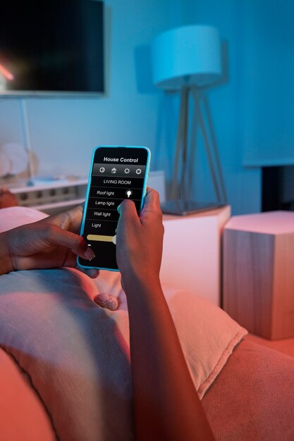 Hand holding smartphone at home