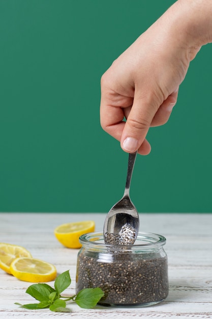 Free photo hand holding spoon close up