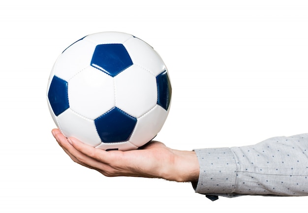 Hand of man holding a soccer ball