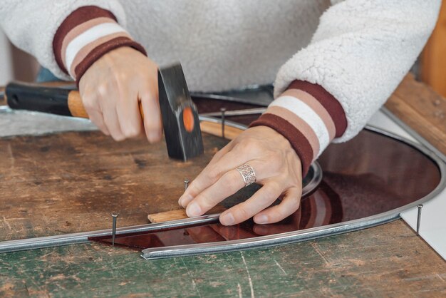 hand of master glassmaker at work