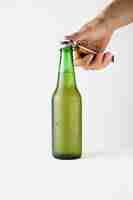 Free photo hand opening beer bottle