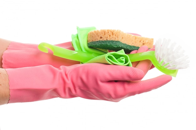 Hand in a pink glove holding sponge 