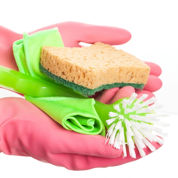 Free photo hand in a pink glove holding sponge