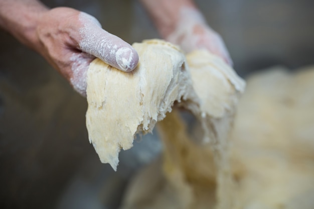 Hand preparing dough