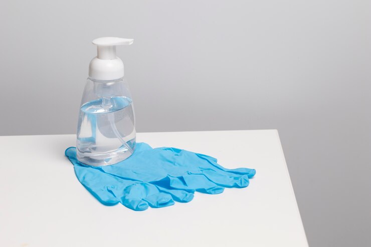 Free Photo hand sanitizer and protection gloves