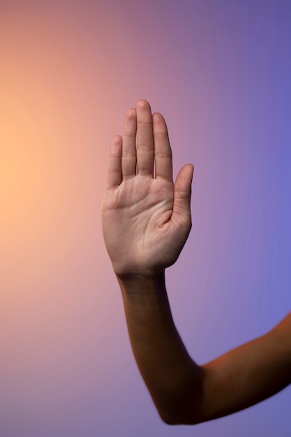 Hand showing stop sign