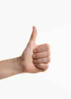 Free photo hand showing thumbs up