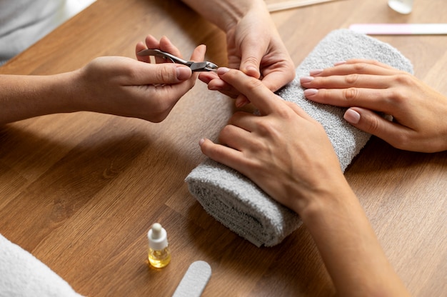 Hand using nail scissors close up