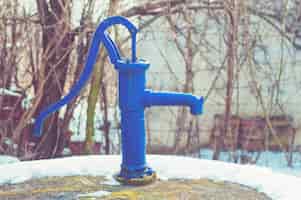 Free photo hand water pump - retro style (old water pump)