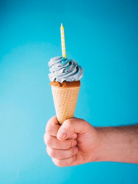 Hand with cupcake ice cream