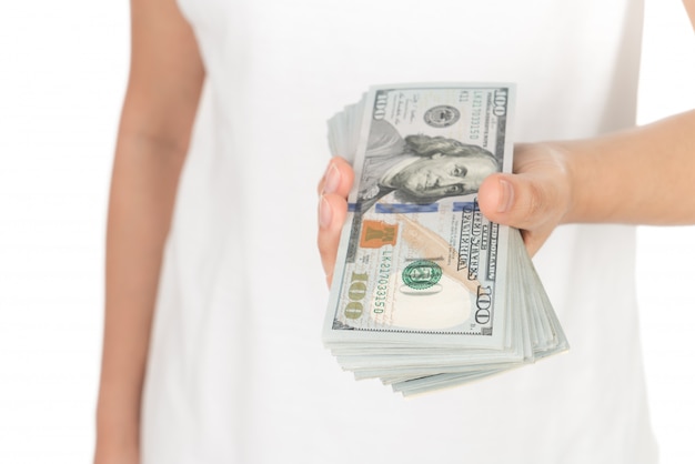 Hand with dollars isolated on white background