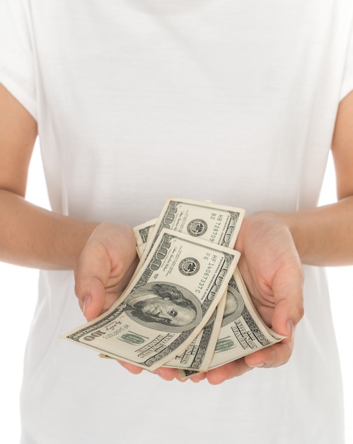 Hand with dollars isolated on white background