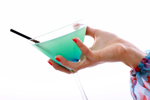 Hand with glass of cocktail