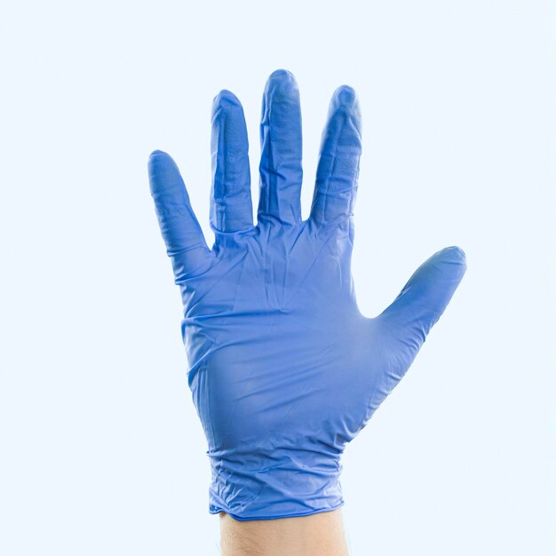 Hand with latex glove showing palm