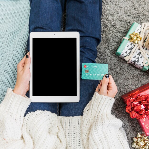 Hand with tablet and credit card 