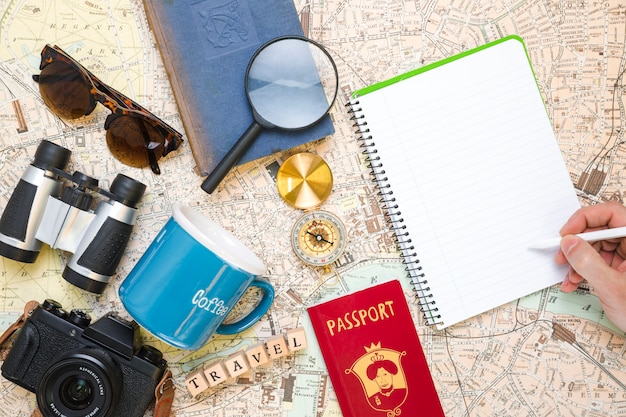 hand writing next to travel elements