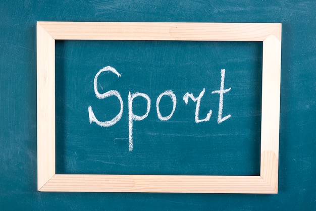 Hand written sport word on blackboard