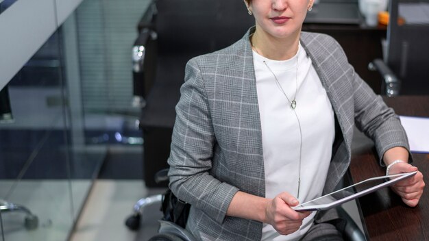 Handicapped young woman in office high view