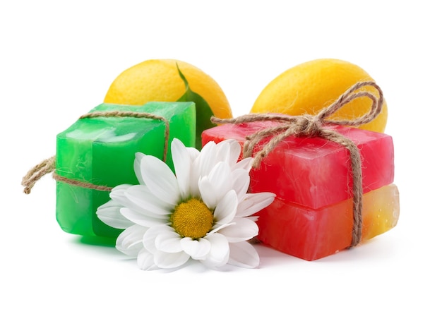 Handmade citrus soap and fresh fruit on white background