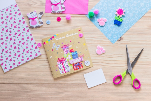 Handmade creative birthday card on wooden table