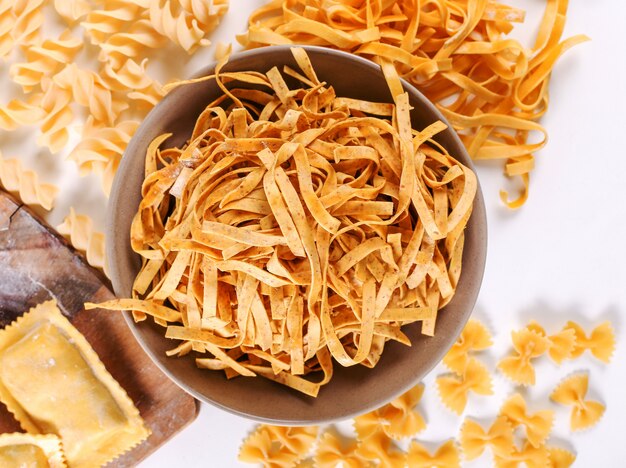 Handmade pasta in a wooden bowl