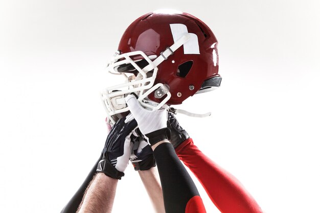 The hands of american football players with helmet on white background