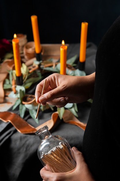 Hands assembling advent wreath