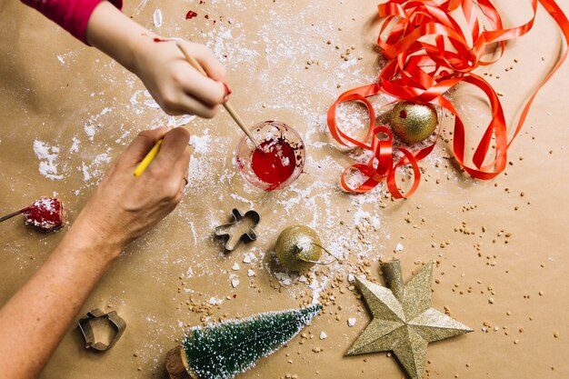 Hands and christmas ornaments