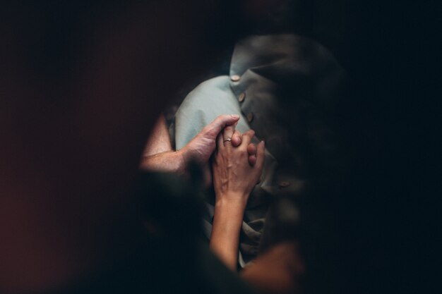 Hands close up of couple on honeymoon