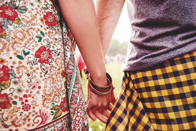 Hands of couple at the festival